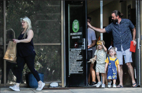 Parent Jade Goodwin and her family exit the NE Children’s Center for the last time on Friday Oct. 11. 